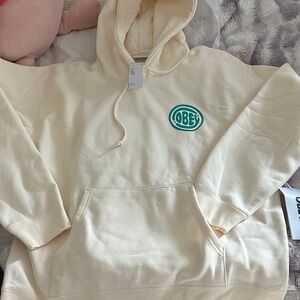 Obey Cream Hoodie with Green Logo